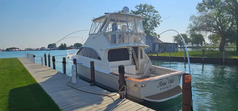 Slide: The Image of 1997 Ocean Yachts 48 Super Sport at dock, sunny day. - 49