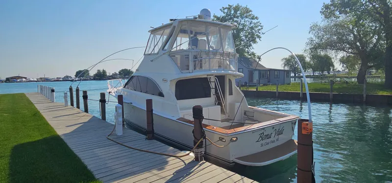 Slide: The Image of 1997 Ocean Yachts 48 Super Sport docked on a sunny day. - 6