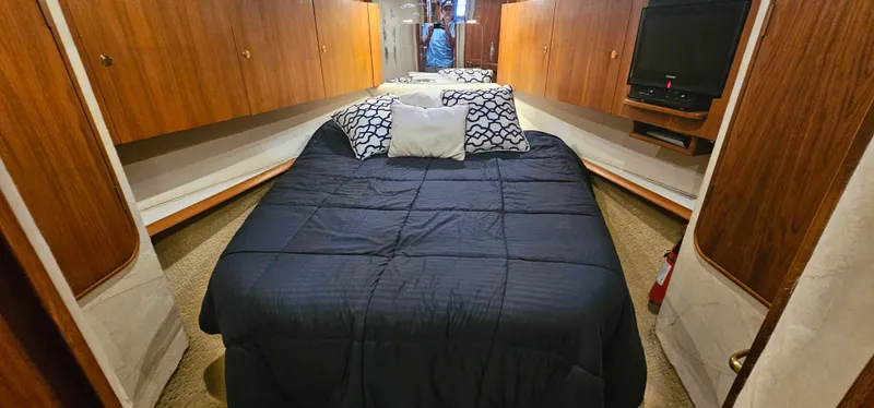 Slide: The Image of Bedroom in a 1997 Ocean Yachts 48 Super Sport. - 36