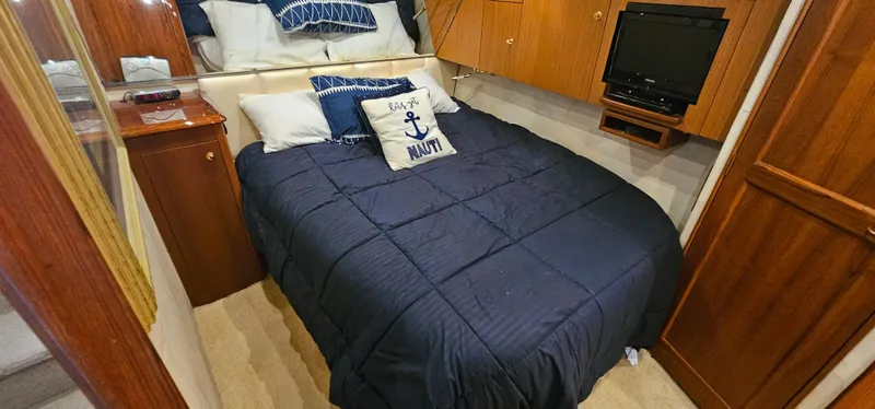 Slide: The Image of Bedroom on a 1997 Ocean Yachts 48 Super Sport. - 38