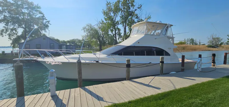 Slide: The Image of 1997 Ocean Yachts 48 Super Sport docked on a sunny day. - 5