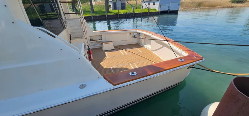 Slide: The Image of 1997 Ocean Yachts 48 Super Sport at dock, sunny day. - 8