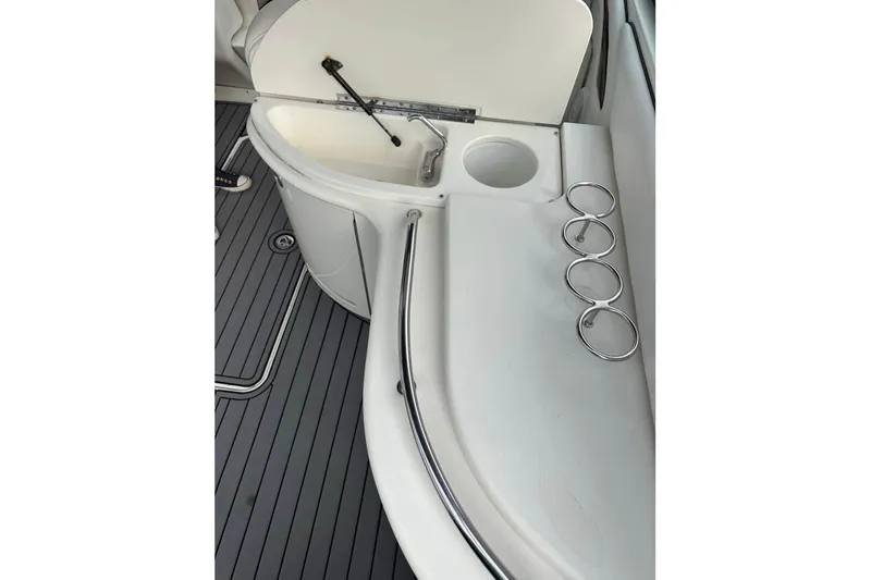 Slide: The Image of 2007 Sea Ray 290 Sun Sport boat interior with cup holders and sink. - 7