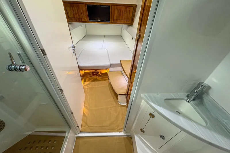 Slide: The Image of Interior cabin of 2024 HCB 53' Suenos boat with modern amenities and sleek design. - 12