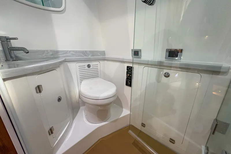 Slide: The Image of Luxurious bathroom in 2024 HCB 53' Suenos yacht, featuring modern fixtures and sleek design. - 15