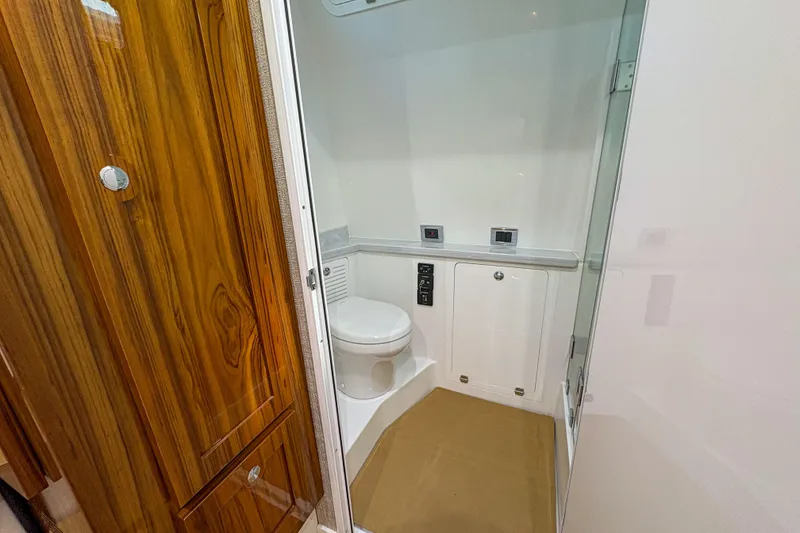 Slide: The Image of Luxurious bathroom interior of 2024 HCB 53' Suenos yacht with wooden accents. - 18