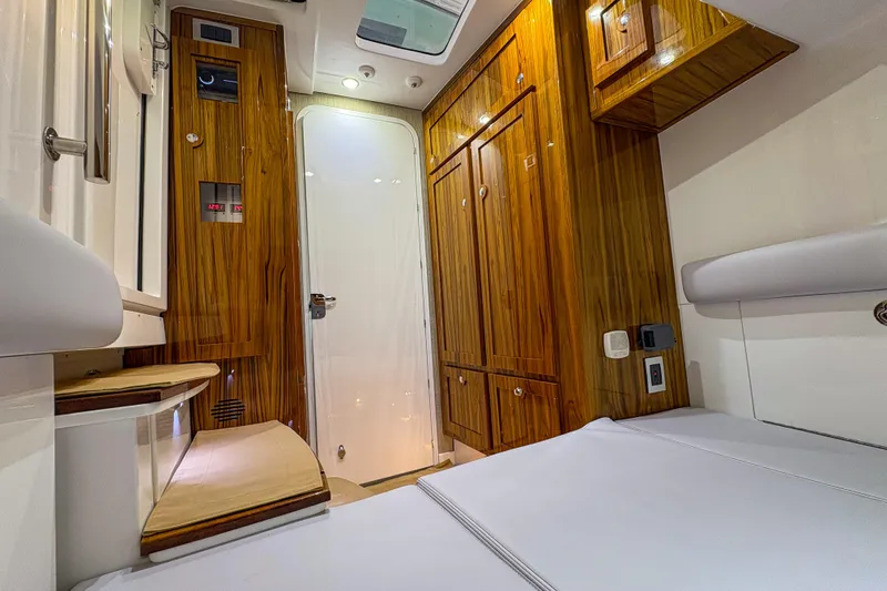Slide: The Image of Luxurious interior of 2024 HCB 53' Suenos boat with wood cabinetry and modern amenities. - 19