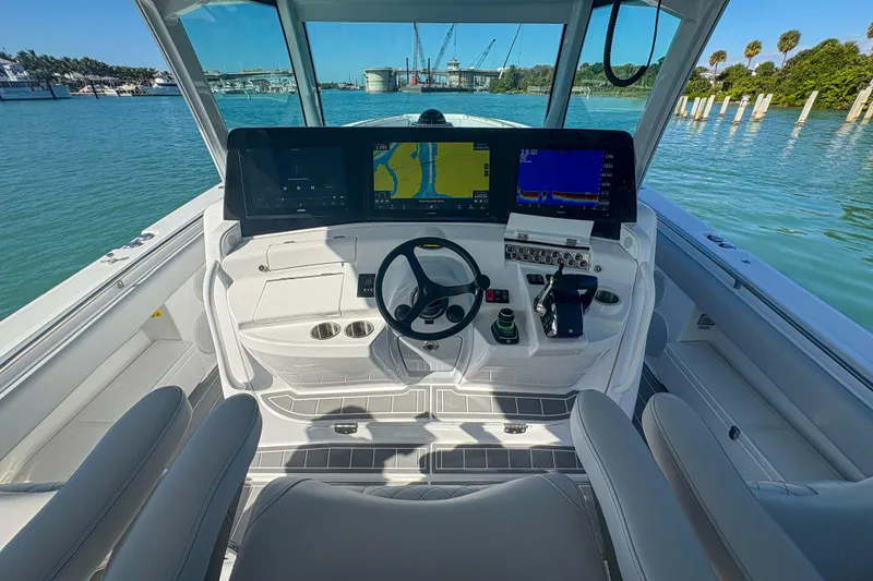 Slide: The Image of 2024 HCB 53' Suenos boat helm with advanced navigation displays and controls. - 26