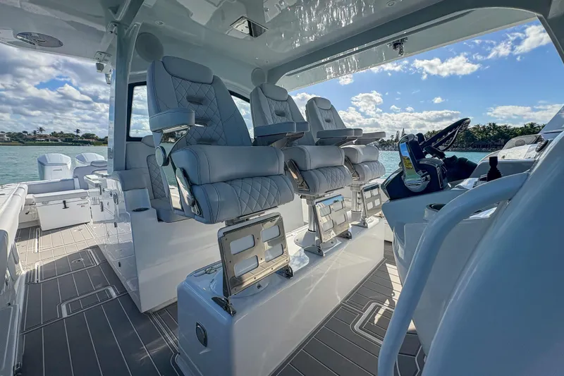 Slide: The Image of Luxurious interior of 2024 HCB 53' Suenos boat with plush seating and modern controls. - 28