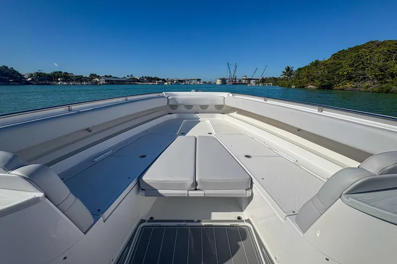 Slide: The Image of 2024 HCB 53' Suenos boat interior with spacious seating, on a sunny day. - 30