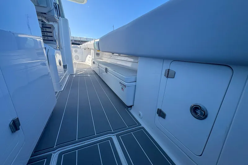 Slide: The Image of 2024 HCB 53' Suenos boat deck with sleek design and storage compartments. - 40