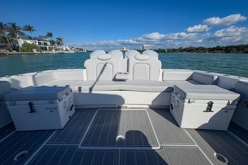 Slide: The Image of 2024 HCB 53' Suenos boat interior with luxurious seating and scenic waterfront view. - 53