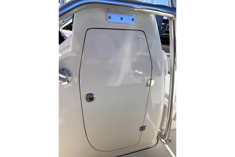 Slide: The Image of 2015 Release 190RX boat console with stainless steel railing and storage compartment. - 12