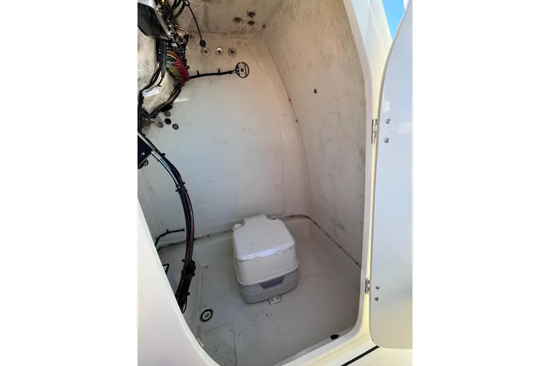 Slide: The Image of Interior of a 2015 Release 190RX boat, featuring a compact storage compartment. - 13