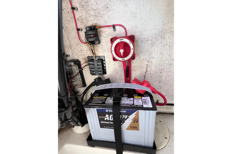 Slide: The Image of Battery setup in a 2015 Release 190RX boat with wiring and switch. - 14