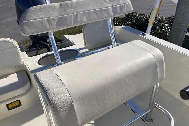 Slide: The Image of 2015 Release 190RX boat seating with white upholstery and stainless steel frame. - 17