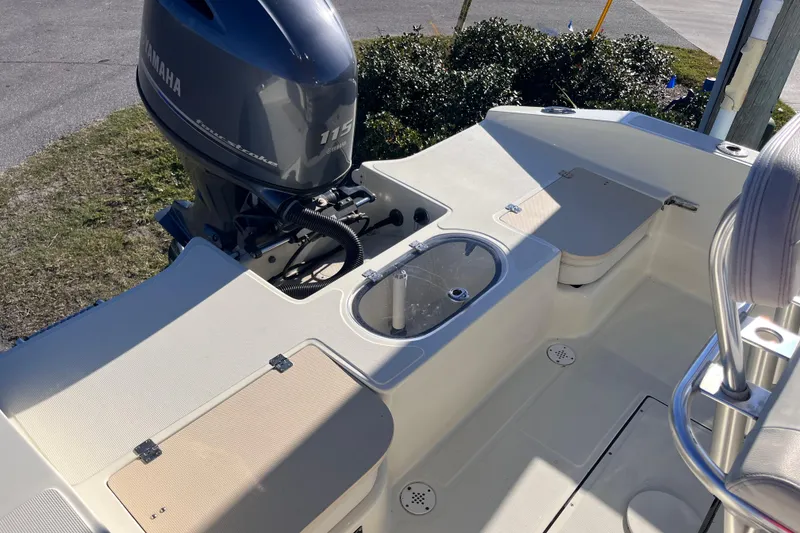 Slide: The Image of 2015 Release 190RX boat with Yamaha 115 outboard motor, featuring spacious deck layout. - 18