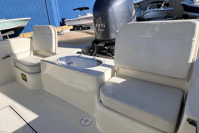 Slide: The Image of Interior of a 2015 Release 190RX boat with seating and Yamaha 115 engine. - 4