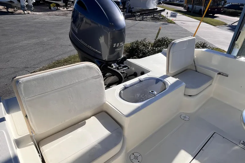 Slide: The Image of Boat interior with Yamaha 115 engine, seating, and storage on a 2015 Release 190RX model. - 5