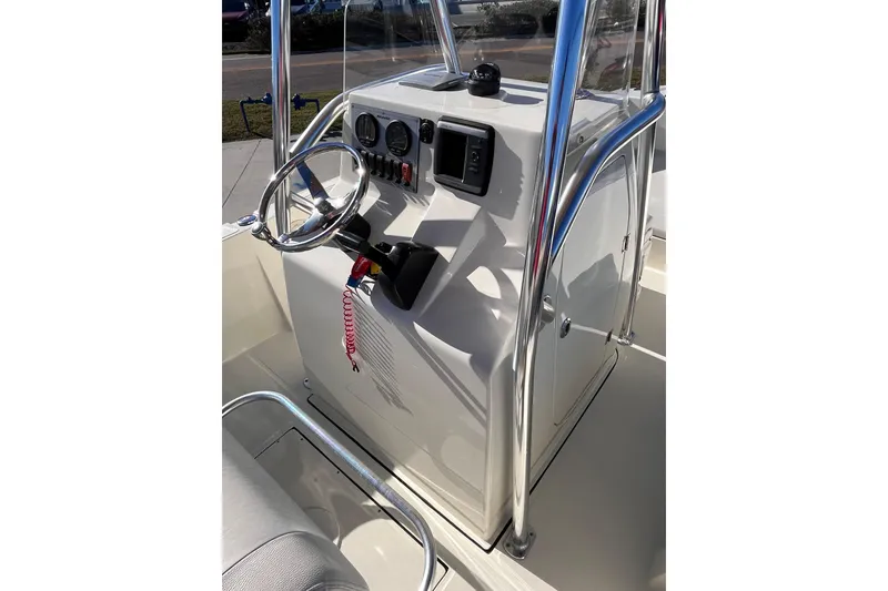 Slide: The Image of 2015 Release 190RX boat console with steering wheel and gauges. - 9