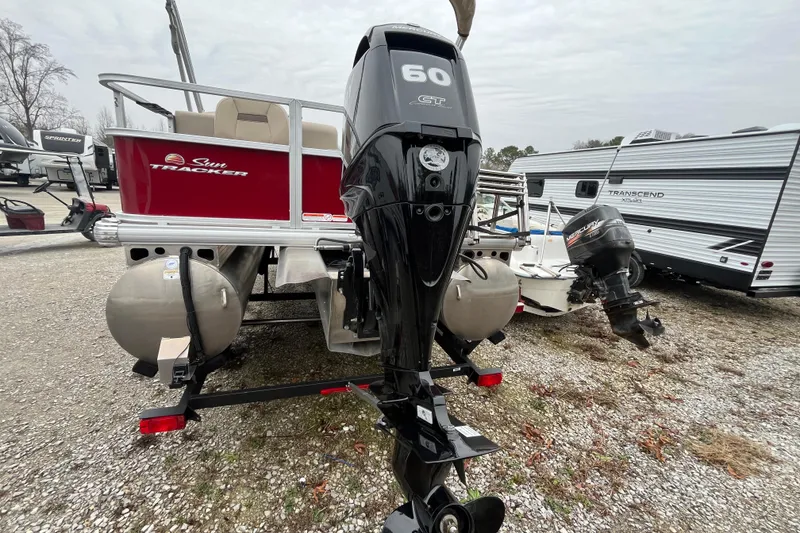 Slide: The Image of 2025 Sun Tracker Bass Buggy 18 DLX pontoon boat with 60 HP outboard motor. - 21