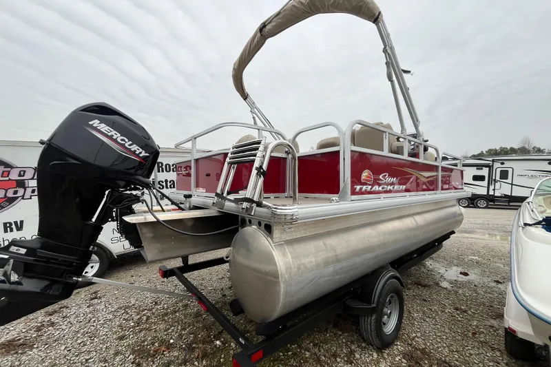 Slide: The Image of 2025 Sun Tracker Bass Buggy 18 DLX pontoon boat with Mercury outboard motor. - 22