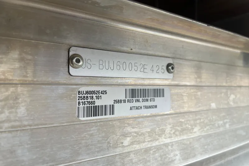 Slide: The Image of 2025 Sun Tracker Bass Buggy 18 DLX identification plate with serial and model numbers. - 25