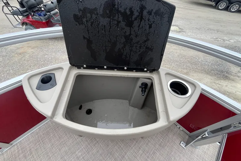 Slide: The Image of Open storage compartment on 2025 Sun Tracker Bass Buggy 18 DLX boat. - 5