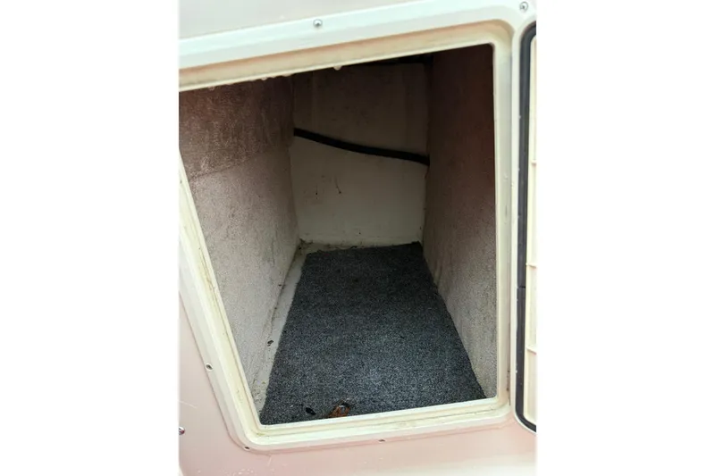 Slide: The Image of Interior cabin of 1995 Donzi 212 Medallion boat, featuring carpeted flooring. - 14