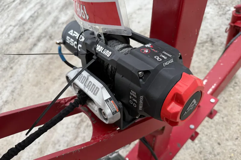 Slide: The Image of 1995 Donzi 212 Medallion winch system on red frame, featuring Proland branding. - 19