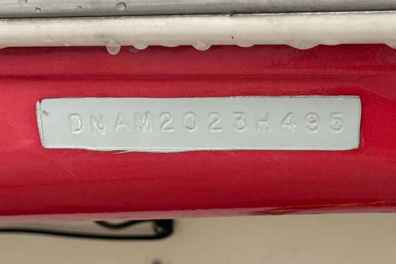 Slide: The Image of 1995 Donzi 212 Medallion boat hull identification number on red surface. - 22