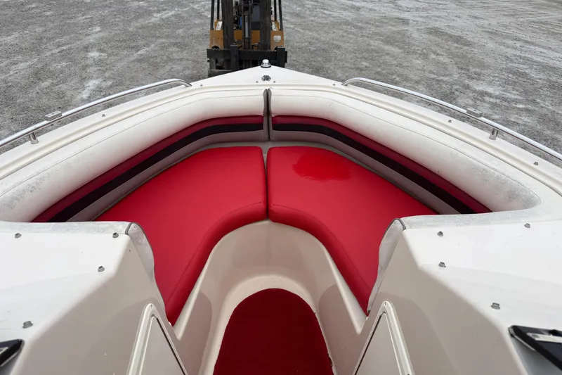 Slide: The Image of 1995 Donzi 212 Medallion boat with red seating and white interior. - 6