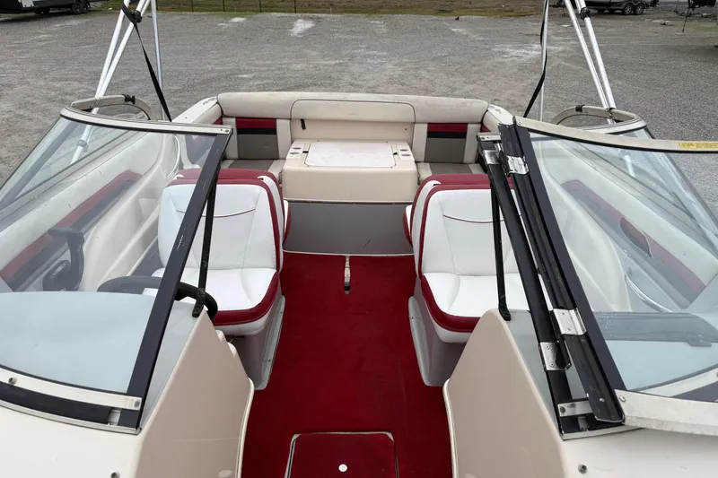 Slide: The Image of 1995 Donzi 212 Medallion boat interior with red and white seating and carpet. - 7