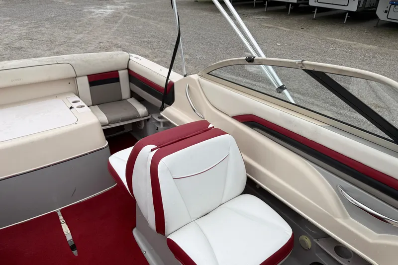 Slide: The Image of 1995 Donzi 212 Medallion boat interior with red and white seating and carpet. - 8