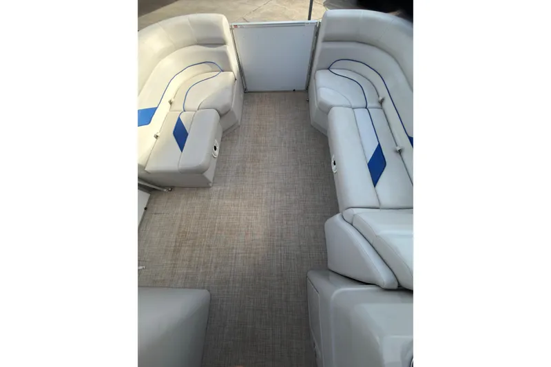 Slide: The Image of 2021 SunCatcher Select 20C pontoon boat interior with plush seating and modern design. - 13