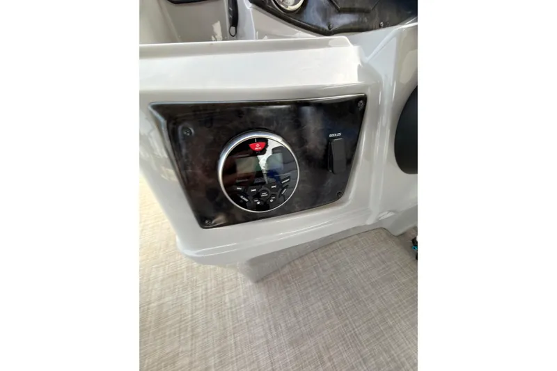Slide: The Image of 2021 SunCatcher Select 20C boat dashboard with control panel and audio system. - 15