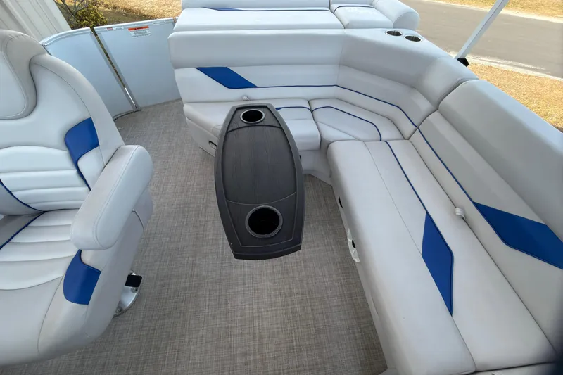 Slide: The Image of Interior of 2021 SunCatcher Select 20C pontoon boat with white and blue seating. - 17