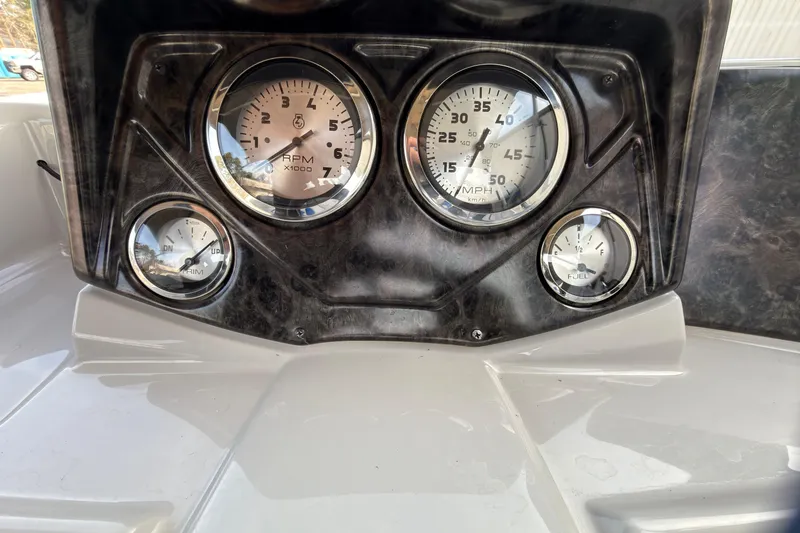 Slide: The Image of Dashboard of 2021 SunCatcher Select 20C boat with gauges for RPM, speed, and fuel. - 8