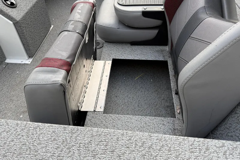 Slide: The Image of 2021 G3 Sportsman 1810 boat interior with open storage compartment under seat. - 14