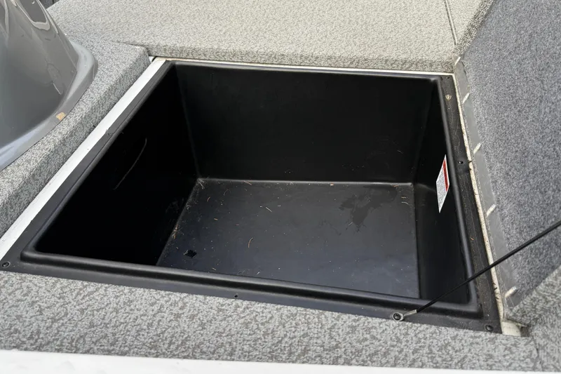 Slide: The Image of Open storage compartment in 2021 G3 Sportsman 1810 boat, featuring a spacious interior. - 17