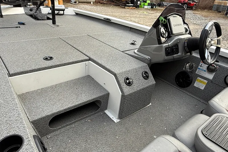 Slide: The Image of 2021 G3 Sportsman 1810 boat interior with steering console and seating area. - 9