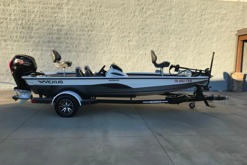 The Image of 2022 Vexus AVX1880 fishing boat on trailer, parked outdoors. - 0