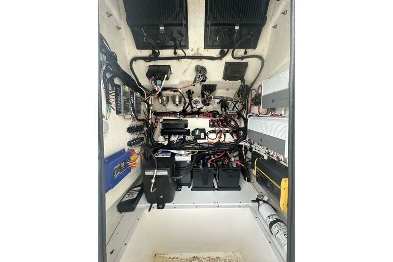 Slide: The Image of Electrical system of a 2022 BlackJack 256 Bay boat, featuring batteries and wiring. - 18