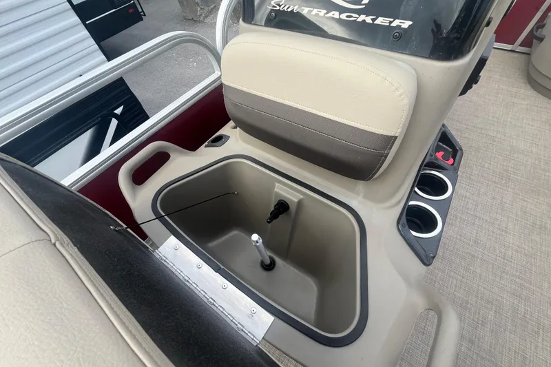 Slide: The Image of 2025 Sun Tracker Bass Buggy 16 XL Select console with storage and cup holders. - 12