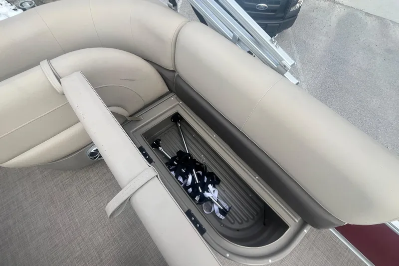 Slide: The Image of 2025 Sun Tracker Bass Buggy 16 XL Select boat with open storage compartment. - 19