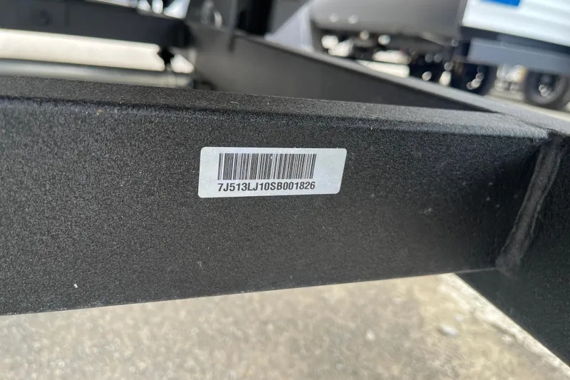 Slide: The Image of 2025 Sun Tracker Bass Buggy 16 XL Select trailer with visible barcode and serial number. - 21