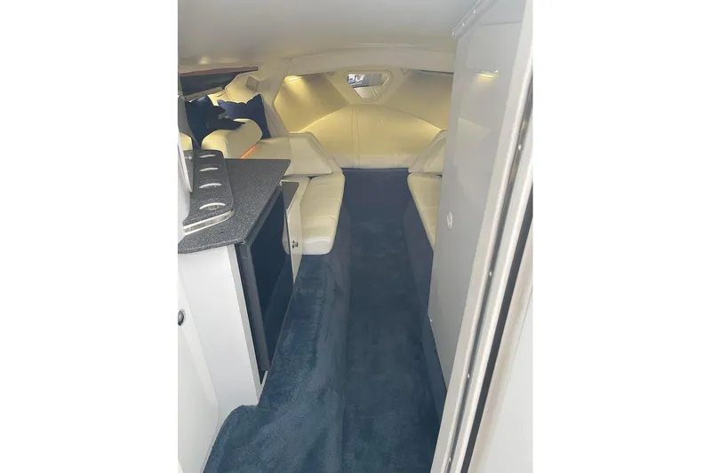 Slide: The Image of Interior of 2001 Fountain 35 Lightning boat with white seating and dark carpet. - 16