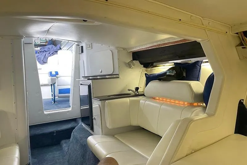 Slide: The Image of Interior of a 2001 Fountain 35 Lightning boat with white seating and modern amenities. - 18