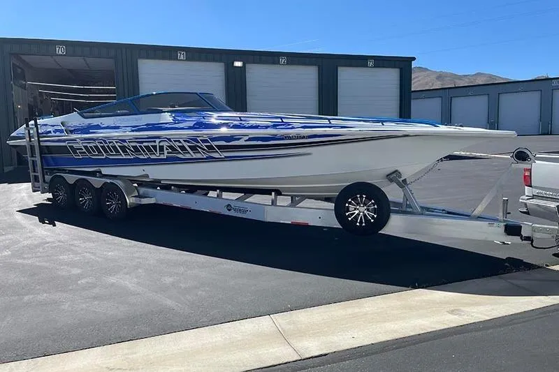 Slide: The Image of 2001 Fountain 35 Lightning boat on trailer, parked outside storage units. - 6