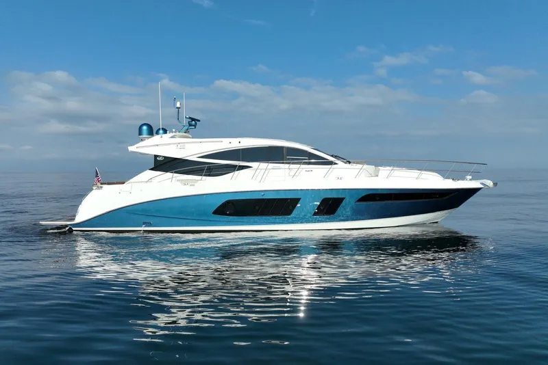 The Image of 2016 Sea Ray L650 yacht on calm ocean under clear blue sky. - 0